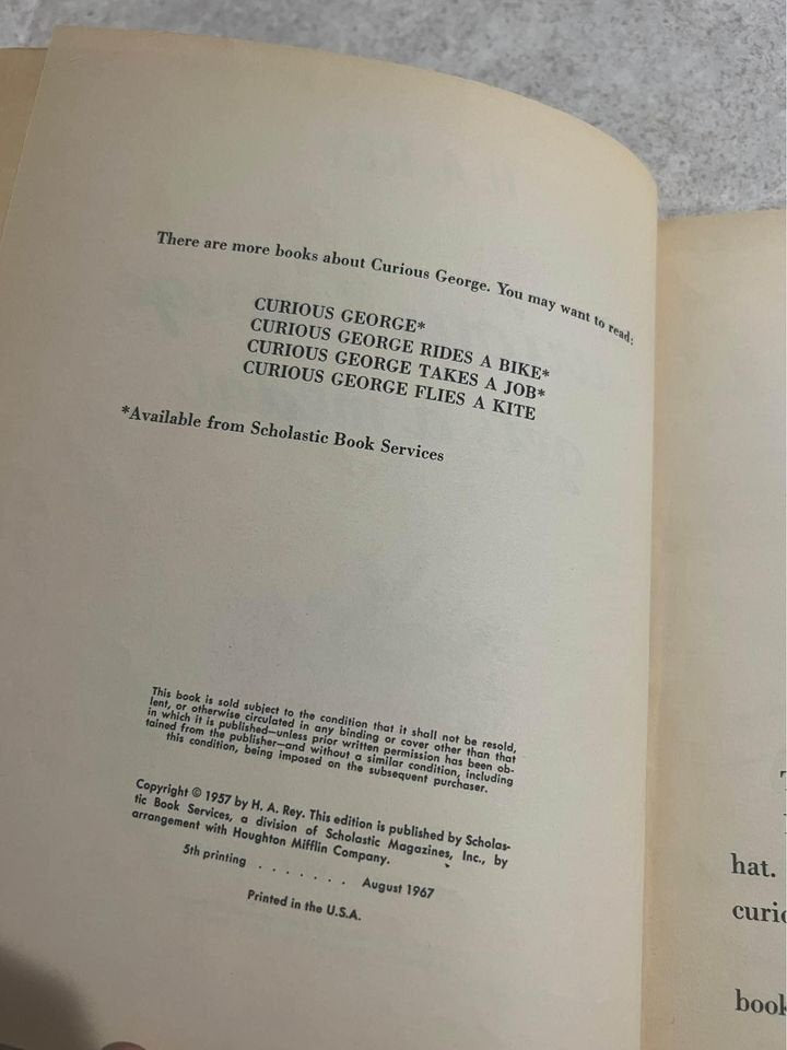 Curious George Gets A Medal by H. A. Rey Vintage Scholastic Paperback Book 1957 / 1967