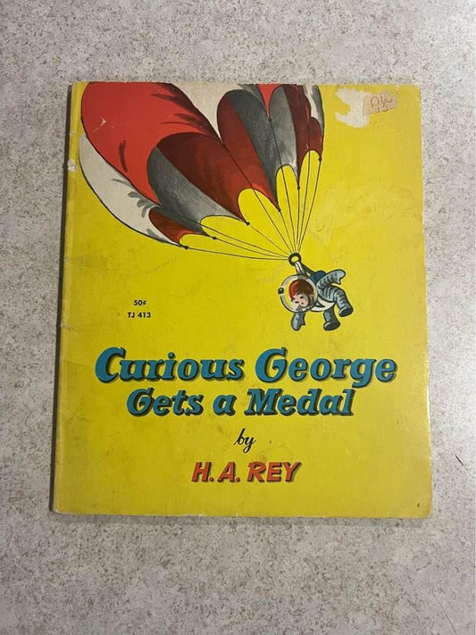 Curious George Gets A Medal by H. A. Rey Vintage Scholastic Paperback Book 1957 / 1967
