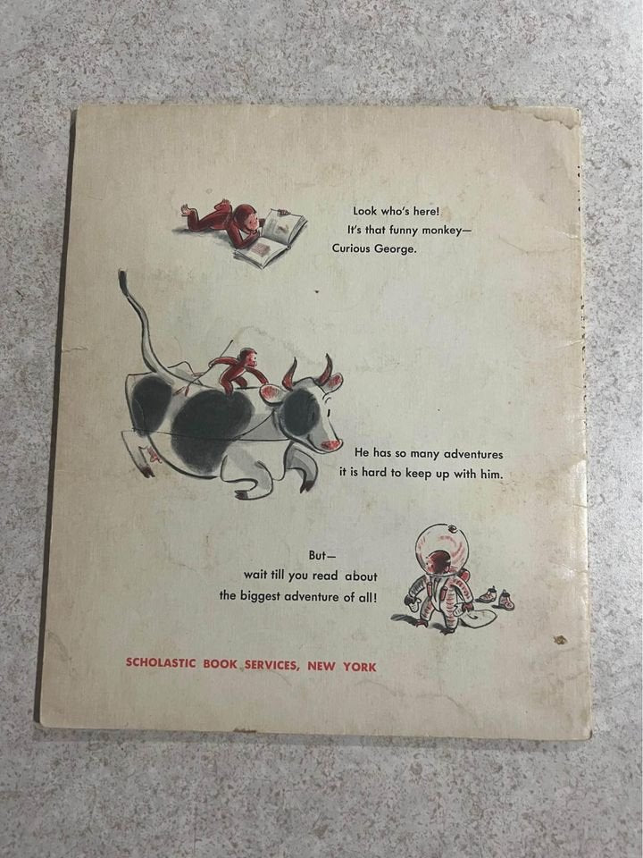 Curious George Gets A Medal by H. A. Rey Vintage Scholastic Paperback Book 1957 / 1967